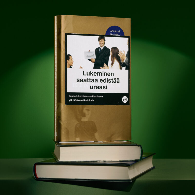 Kirjan kannessa varoitustarra: Lukeminen saattaa edistää uraasi.